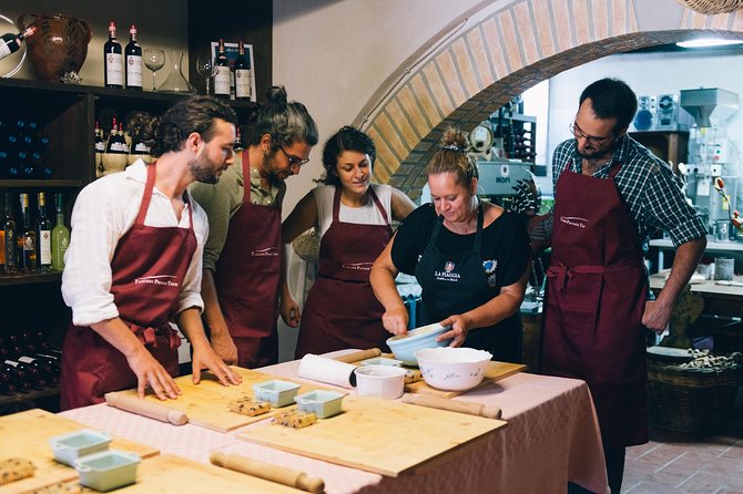 Fresh pasta dough rolled on a floured marble surface in a sunlit Italian kitchen