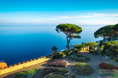 Ancient stone arch framing a Mediterranean sea view in Ravello
